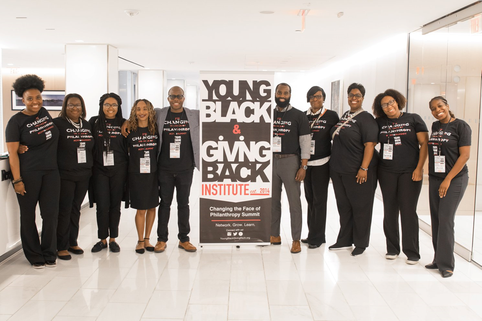 Black group, holding a sign